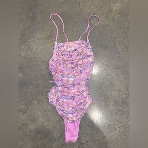 Free people body suit. Corset back and criss-cross straps. Never worn. Size M